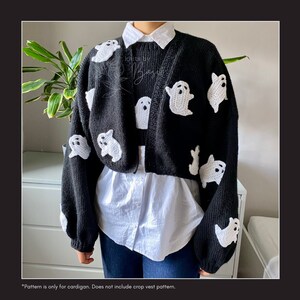 May include: Black cardigan with white ghost appliques. The cardigan is cropped and has long sleeves. *Pattern is only for cardigan. Does not include crop vest pattern.*