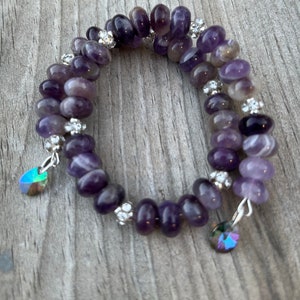 10 mm amethyst , silver tone memory wire bracelet adorned with Swarovski crystals.