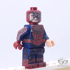 May include: A custom Lego minifigure of Spider-Man in a battle-damaged state. The figure features a red and blue costume with a web design, and a distressed mask revealing a portion of Peter Parker's face. The figure has a light skin tone and red hands.