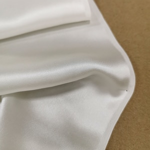 19MM SILK SATIN CREPE in off-white, 44&quot; in width 100% crepe backed satin cut-to-length by yard or meter