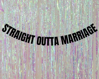 May include: Black and white banner with the text "Straight Outta Marriage" hanging against a shimmering iridescent background.