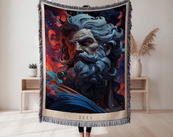 May include: Woven throw blanket featuring a detailed illustration of Zeus with a blue beard and hair, set against a vibrant backdrop of red, orange, and blue hues. The word "ZEUS" is displayed at the bottom. The blanket has a fringed edge.