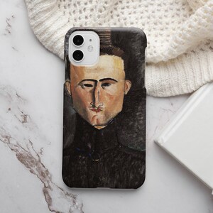 May include: A phone case featuring a painting of a man with dark hair and a dark jacket. The man has a serious expression and is looking directly at the viewer. The background is a dark, abstract design.