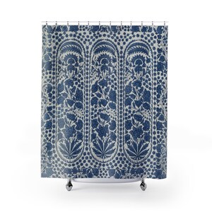 May include: A shower curtain featuring a repeating vertical pattern of dark blue floral and botanical motifs on a light gray background. The design consists of three distinct arched panels filled with intricate blossoms and leaves.