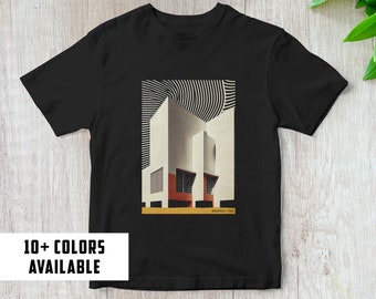 May include: Black t-shirt with a graphic print of a white building with red and yellow accents. The text "BRUNNO TAUZ 1923" is printed below the building.