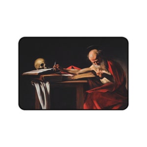 May include: A painting of a man in a red robe writing in a book. A skull is on the table next to him.