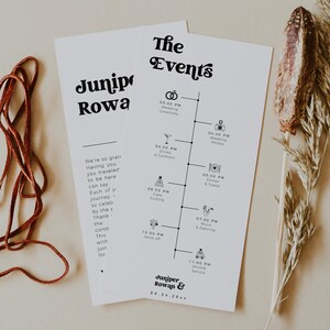 Pode incluir: Dois cartões brancos de linha do tempo de eventos de casamento com texto preto, apresentando uma linha do tempo de eventos e os nomes "Juniper Rowan &" e a data. Um cordão de couro marrom e um raminho de planta seca também estão presentes.