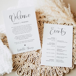 May include: Two white rectangular wedding stationery cards with black text. The left card features the word Welcome, a message to family and friends, and the names Isabella and Thomas. The right card lists a weekend event schedule with dates and times.