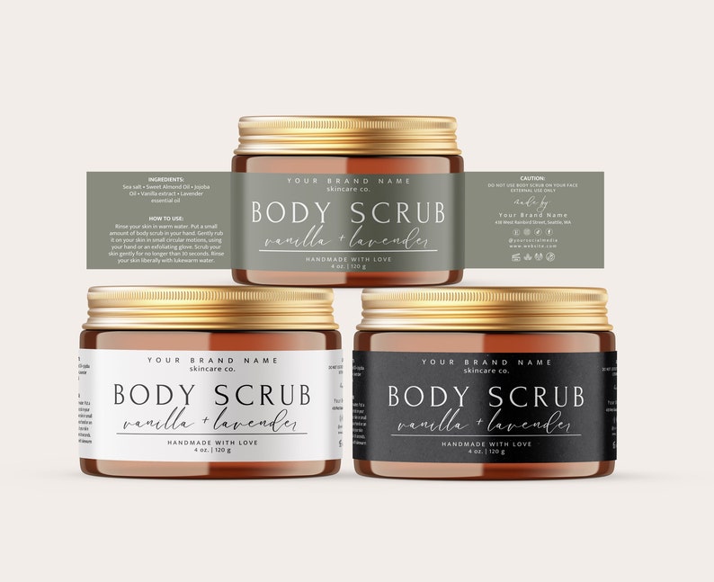 May include: Three amber glass jars with gold lids containing body scrub. The labels are white with black text and say "Your Brand Name skincare co. BODY SCRUB vanilla + lavender. HANDMADE WITH LOVE 4 oz | 120g".