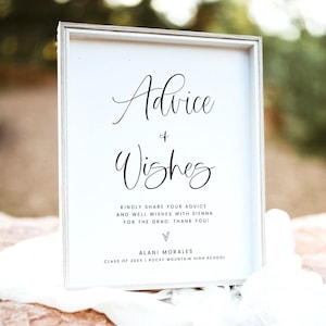 May include: A framed white sign with the words "Advice & Wishes" in elegant black script. Below, text invites guests to share advice and well wishes for Sienna, with a thank you. The sign includes the name Alani Morales and Rocky Mountain High School.