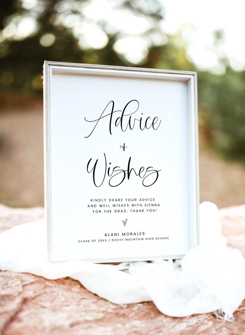 May include: A framed white sign with the words "Advice & Wishes" in elegant black script. Below, text invites guests to share advice and well wishes for Sienna, with a thank you. The sign includes the name Alani Morales and Rocky Mountain High School.