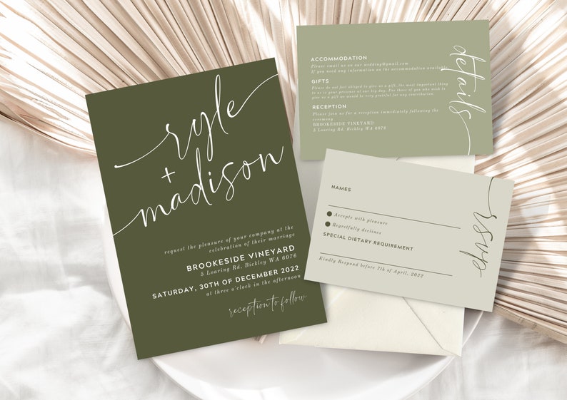 May include: A green wedding invitation with white calligraphy that reads "ryle + madison" and details for the wedding reception at Brookside Vineyard on Saturday, December 30th, 2022. A matching RSVP card with a green background and white text.
