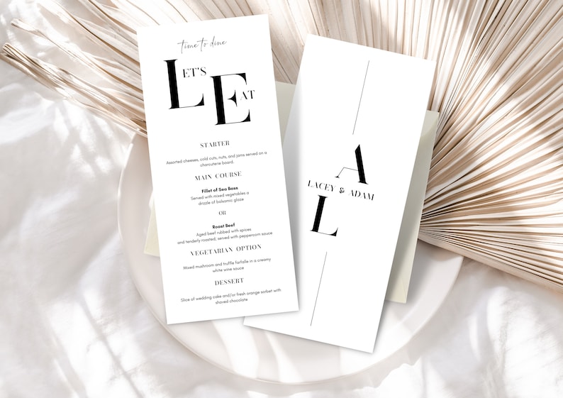 May include: A white wedding menu card with black text. The menu includes a starter, main course, vegetarian option, and dessert. The card also includes the text "Let's Eat" and "Time to Dine".