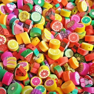 May include: A colourful collection of fruit-shaped beads, featuring lemons, watermelons, and kiwis. These beads are ideal for jewellery making and craft projects. The beads are made from a durable material and have a hole for threading. Measurements are in centimetres.