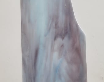 May include: A sheet of translucent glass with a swirling pattern of blue, purple, and white. The glass is 12 inches by 6 inches and is labeled "PR 23 12" x 6".