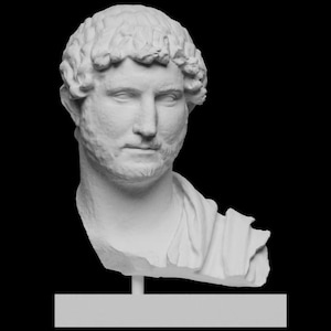 May include: A white bust of a man with curly hair and a beard, set against a black background. The sculpture is mounted on a rectangular base. The man's expression is serious.