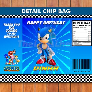 May include: A blue and white chip bag with a cartoon image of Sonic the Hedgehog. The bag has the text "Happy Birthday" and "Sonic" on it. The back of the bag has a nutrition facts label with the text "Birthday Nutrition Facts".
