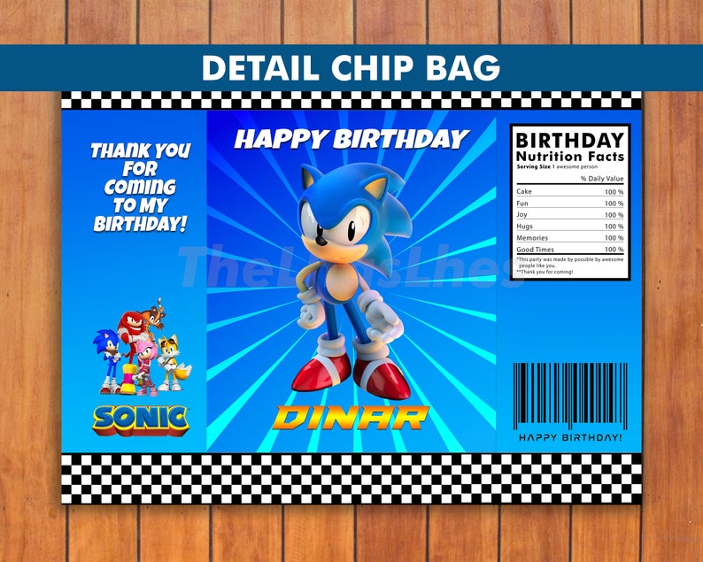 May include: A blue and white chip bag with a cartoon image of Sonic the Hedgehog. The bag has the text "Happy Birthday" and "Sonic" on it. The back of the bag has a nutrition facts label with the text "Birthday Nutrition Facts".