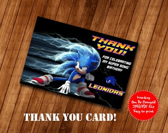 May include: Thank you card featuring Sonic the Hedgehog from the movie Sonic the Hedgehog. The card has a black background with blue lightning bolts and a blue and red Sonic the Hedgehog running across the card. The text on the card reads "Thank You! For celebrating my Super Sonic Birthday. Leonidas".