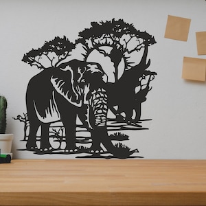 May include: Black metal wall art featuring a silhouette of an elephant walking through a savanna landscape with trees. The art is mounted on a white wall.