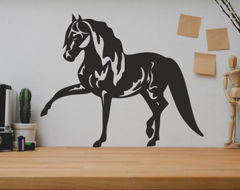May include: Black silhouette of a horse with its front leg raised, on a white wall. The horse is a wall decal, and there are other decorative items on the wall, including a wooden mannequin and a vase with branches.
