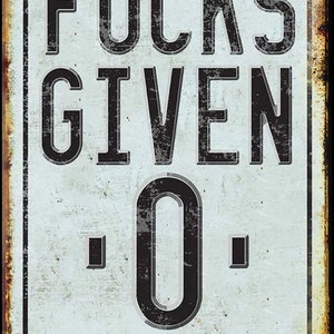 May include: A white metal sign with black text that reads "F*CKS GIVEN: 0 REGRETS: 0". The sign has a distressed, rusty look.