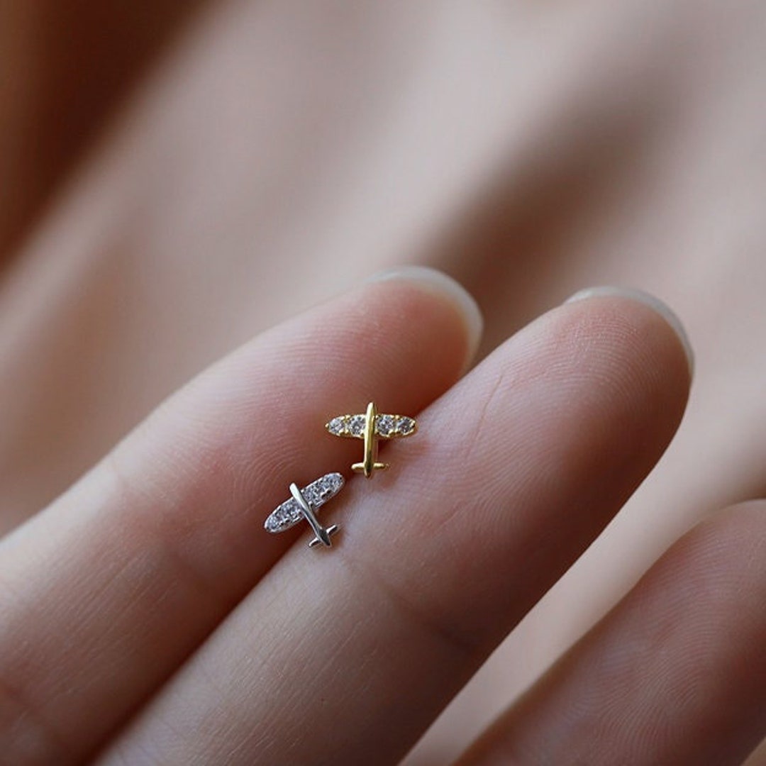 Gold airplane best sale earrings