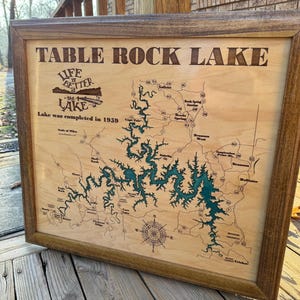 May include: A wooden plaque with a map of Table Rock Lake, Missouri. The lake is outlined in green and the text "Life is Better at the Lake" is at the top. The text "Lake was completed in 1959" is below the map.