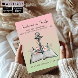 May include: A pink and green journal with an anchor and open book design. The title is "Anchored in Faith: Anchored Reflections: A Mother & Daughter Journal of Faith". The authors are Dr. Lauren B. Robins & Kaliyah Jay.
