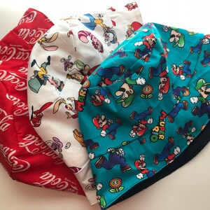 Alice in Wonderland Coca Cola Super Mario Bros Reversible Blue Cotton Bucket Hat