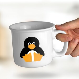 May include: White ceramic mug featuring a black and orange penguin illustration. The penguin is wearing a white belly and has a small orange beak.