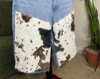 Denim shorts with cow print fur detail