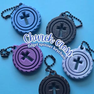 May include: Fidget spinner keychains in various colors, each featuring a cross design. The keychains are round with a textured edge and a small chain for attachment. The text "Church cross fidget spinner keychain" is visible.