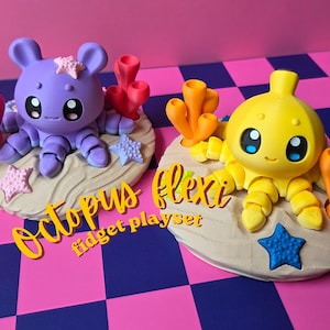 May include: Two colorful octopus fidget playsets. One is purple with pink accents, the other is yellow with orange accents. Each octopus sits on a sandy base with coral and starfish details. The text "Octopus flexi fidget playset" is visible.