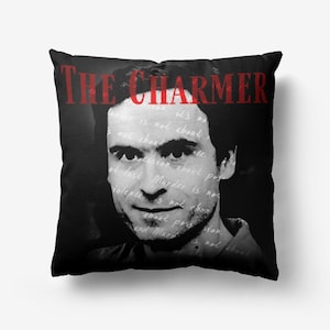 May include: Black and white throw pillow featuring a portrait of a man and the text "THE CHARMER" in red. The background is filled with handwritten text.