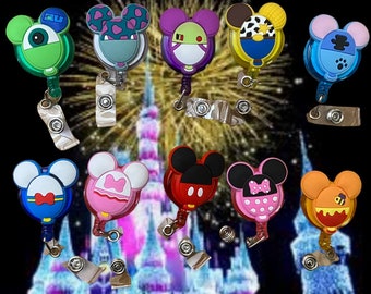 May include: Ten colorful retractable badge holders with different Disney character designs. The holders are made of plastic and have a clear, round shape. The characters include Mickey Mouse, Minnie Mouse, Stitch, and others.