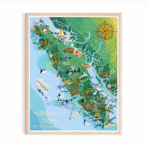 May include: A framed map print of Vancouver Island, British Columbia, Canada. The map is illustrated with a green and blue color scheme, featuring landmarks, boats, and a compass rose. The words "Vancouver Island" are written in a decorative font.