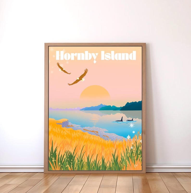 May include: A retro-style poster with the text "Hornby Island" in white letters against a pink sunset sky. The poster features a landscape with a body of water, mountains, and a grassy shoreline. Two eagles fly in the sky, and two orcas swim in the water.