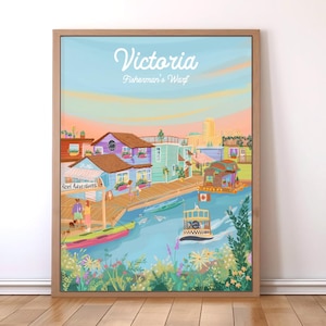 Puede incluir: Una impresión artística enmarcada de Victoria, Fisherman's Wharf, con edificios coloridos, botes y un ferry en el agua. El cielo transiciona de azul a naranja y rosa. La impresión incluye el texto "Victoria Fisherman's Wharf".