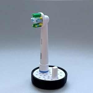 Oral-B toothbrush stand with drip tray, head holder attachment, round design version for the bathroom. Hygienic accessories image 6