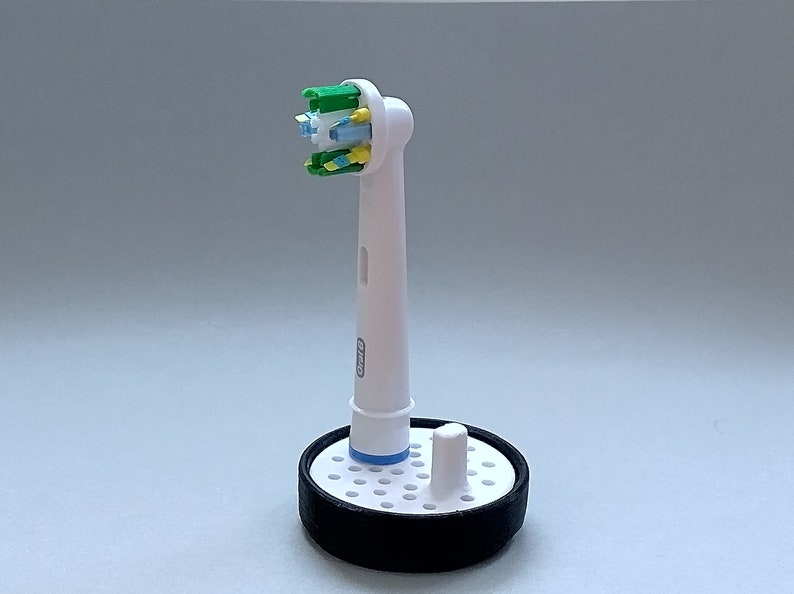 Oral-B toothbrush stand with drip tray, head holder attachment, round design version for the bathroom. Hygienic accessories image 6