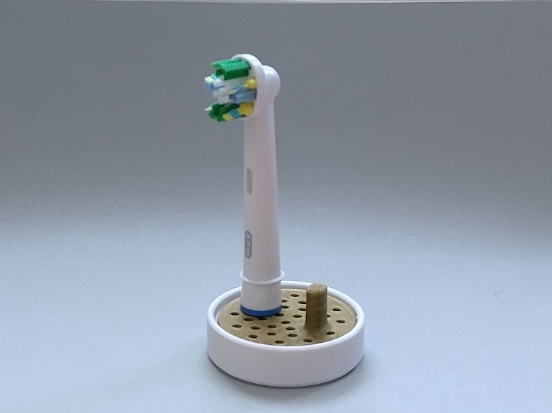 Oral-B toothbrush stand with drip tray, head holder attachment, round design version for the bathroom. Hygienic accessories image 4