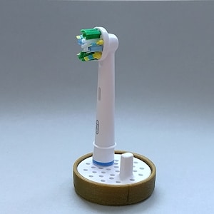 Oral-B toothbrush stand with drip tray, head holder attachment, round design version for the bathroom. Hygienic accessories image 7