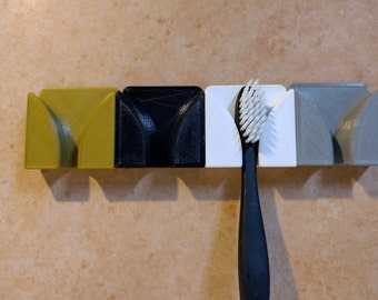 Support pour brosse à dents qui peut être monté ou collé au mur de la salle de bain. décor