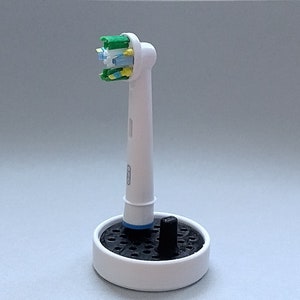 Oral-B toothbrush stand with drip tray, head holder attachment, round design version for the bathroom. Hygienic accessories image 2
