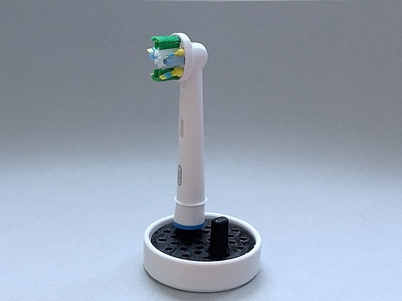 Oral-B toothbrush stand with drip tray, head holder attachment, round design version for the bathroom. Hygienic accessories image 2