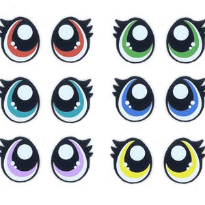 May include: Set of 12 colorful cartoon eyes with black pupils and white highlights. The eyes are in pairs of red, green, blue, purple, and yellow.