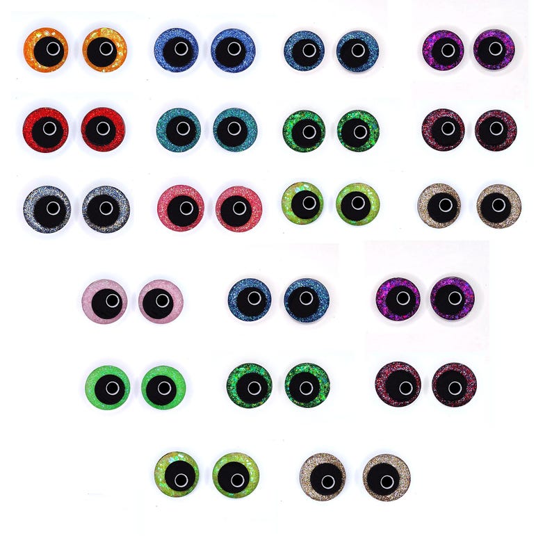 Peut inclure: Une collection d'yeux artisanaux color&eacute;s et scintillants, dans des teintes vari&eacute;es : orange, bleu, rouge, vert, argent, rose, violet et or. Chaque &oelig;il a une pupille noire et un cercle blanc. Id&eacute;al pour le bricolage.