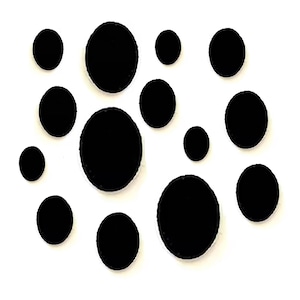 May include: A collection of twelve solid black oval-shaped patches arranged in a scattered pattern. Each patch features a smooth, uniform surface and distinct rounded edges, varying in size from small to large, presented against a plain white background.