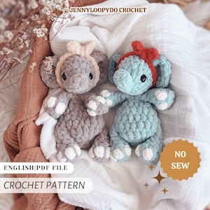 May include: Two crocheted elephant plush toys, one grey and one blue, each with a headband. The grey elephant has a light pink bow, and the blue elephant has a red headband. The image includes the text "CROCHET PATTERN" and "ENGLISH|PDF FILE".